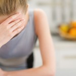 portrait-of-stressed-young-housewife-in-modern-kitchen