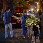 people-walk-outside-a-nightclub-following-an-explosion-in-bucharest