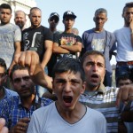 a-syrian-refugee-shouts-for-his-mother-and-sister-outside-the-budapest-railways-station