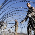 slovenian-soldiers-set-up-barbed-wire-barriers-in-the-village-gibina