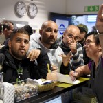 iraqi-refugees-buy-train-tickets-to-turku-from-public-transport-centre-in-tornio-northwestern-finland