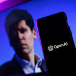 openai-logo-and-sam-altman-in-background-on-screen-openai-fires-ceo-sam-altman