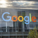 facade-of-modern-google-office-with-colorful-logo-during-sunset