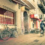 vintage-retro-travel-postcard-of-a-narrow-street-in-the-former-e